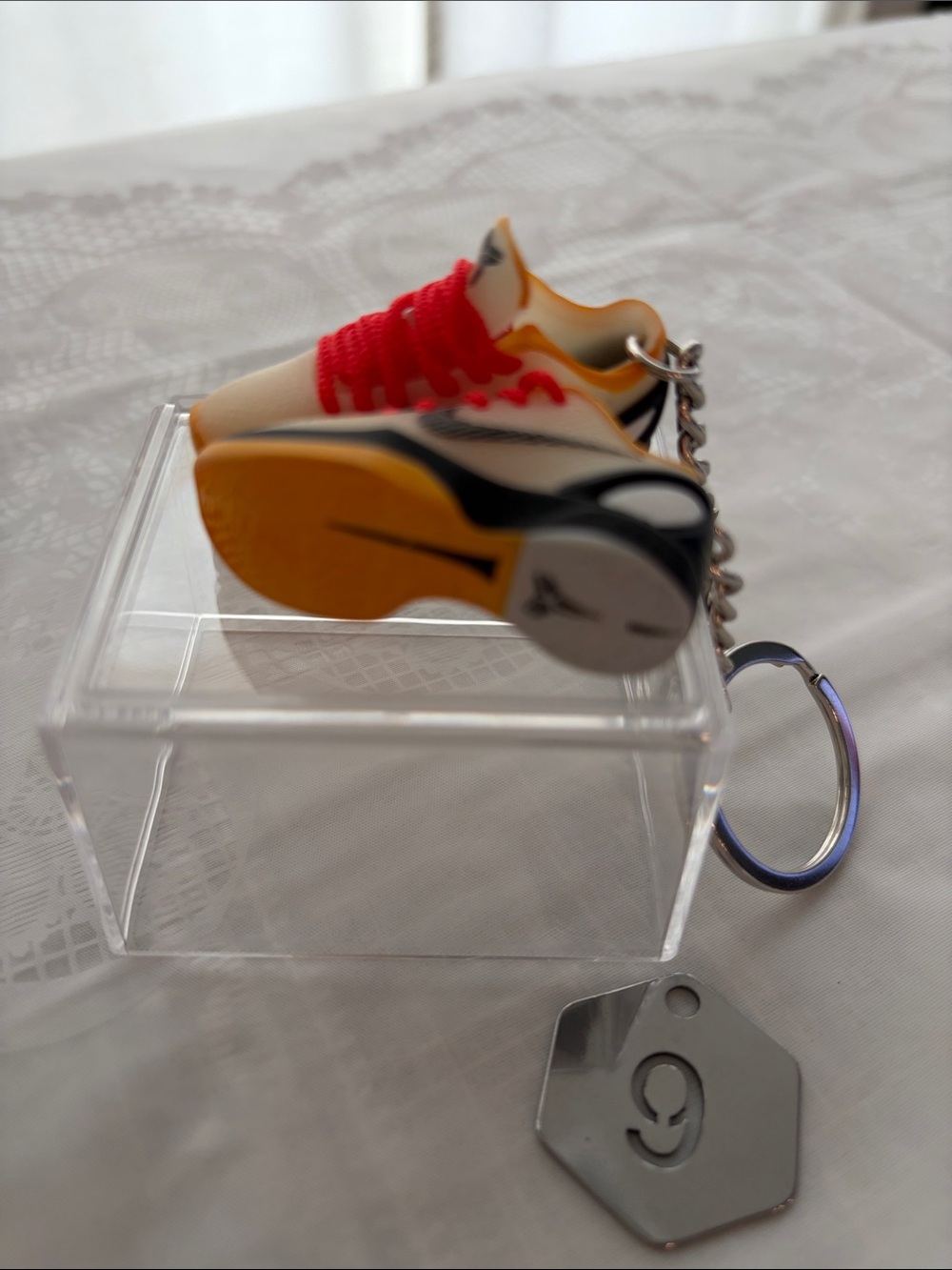 9, One Pair of Nike Logo Mini Sneaker Keychain - Yellow and Red.